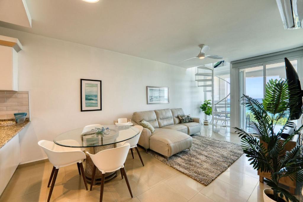 Open living and dining area with ocean light